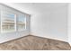 Bright bedroom with neutral carpeting and two windows at 2274 Centerra Loop, Kissimmee, FL 34741