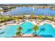 Large community pool with lounge chairs at 2274 Centerra Loop, Kissimmee, FL 34741