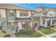 Modern two-story townhome with landscaping at 2274 Centerra Loop, Kissimmee, FL 34741