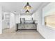 Open kitchen with breakfast bar and modern pendant lighting at 2274 Centerra Loop, Kissimmee, FL 34741