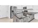 Modern kitchen with stainless steel appliances and granite countertops at 2274 Centerra Loop, Kissimmee, FL 34741
