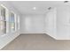 Spacious living room with tile floors and large windows at 2274 Centerra Loop, Kissimmee, FL 34741