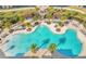 Resort-style pool with lounge chairs and palm trees at 2274 Centerra Loop, Kissimmee, FL 34741