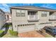 Rear view of townhome with garage and balcony at 2274 Centerra Loop, Kissimmee, FL 34741