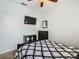 Bedroom with TV, dresser, and patterned bedding at 2305 Butterfly Palm Way # 103, Kissimmee, FL 34747