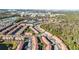 Aerial view of community with resort-style pool and lake at 2621 Bugatti Ct, Kissimmee, FL 34746