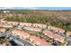 Aerial view of a community of houses near a lake at 2621 Bugatti Ct, Kissimmee, FL 34746