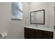 Clean and modern bathroom with dark wood vanity at 2621 Bugatti Ct, Kissimmee, FL 34746