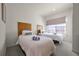 Twin beds, neutral decor, and natural light at 2621 Bugatti Ct, Kissimmee, FL 34746