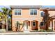 Front view of two-story house with a white door at 2621 Bugatti Ct, Kissimmee, FL 34746