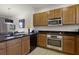 Modern kitchen with stainless steel appliances and island at 2621 Bugatti Ct, Kissimmee, FL 34746