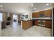 Open concept kitchen with island and view to living area at 2621 Bugatti Ct, Kissimmee, FL 34746
