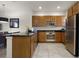 Modern kitchen with stainless steel appliances and an island at 2621 Bugatti Ct, Kissimmee, FL 34746