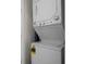 Stackable washer and dryer in a closet at 2621 Bugatti Ct, Kissimmee, FL 34746