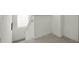 Bright, open staircase with carpet runner and window at 2621 Bugatti Ct, Kissimmee, FL 34746