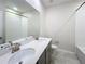 Bright bathroom with double sinks, a quartz countertop, and a shower-tub combination at 272 Muscogee Ln, Orlando, FL 32825