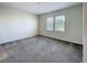 Inviting bedroom with plush carpeting and bright, natural light at 272 Muscogee Ln, Orlando, FL 32825