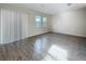 Bright living area featuring sliding glass doors and modern flooring at 272 Muscogee Ln, Orlando, FL 32825