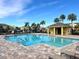 Community pool with lounge chairs and cabana at 272 Muscogee Ln, Orlando, FL 32825