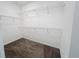 Walk-in closet with carpeted floors and wire shelving for optimal storage solutions at 272 Muscogee Ln, Orlando, FL 32825