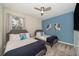 Bedroom with two twin beds, gray accents, and wall art at 2733 Bookmark Dr, Kissimmee, FL 34746