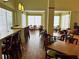 Hotel dining area with tables and chairs at 3000 Maingate Ln # 228, Kissimmee, FL 34747