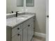 Modern bathroom with granite countertop and gray cabinets at 3011 Hemingway Cir # 3011, Haines City, FL 33844