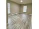 Spacious bedroom with light walls and wood-look flooring at 3011 Hemingway Cir # 3011, Haines City, FL 33844