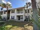 Two-story building with balconies and landscaping at 3011 Hemingway Cir # 3011, Haines City, FL 33844