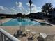 Inviting community pool with lounge chairs at 3011 Hemingway Cir # 3011, Haines City, FL 33844