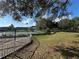 Tennis courts surrounded by trees at 3011 Hemingway Cir # 3011, Haines City, FL 33844