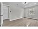 Spacious bedroom featuring luxury vinyl plank flooring, ceiling fan, and lots of light at 3020 Rockingham Cir, Orlando, FL 32808