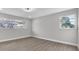Bright bedroom with natural light, ceiling fan, and wood-look flooring at 3020 Rockingham Cir, Orlando, FL 32808