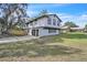 Two-story home with an attached two-car garage and a spacious, grassy lawn at 3020 Rockingham Cir, Orlando, FL 32808