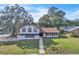Charming two-story home with a well-maintained lawn and inviting curb appeal at 3020 Rockingham Cir, Orlando, FL 32808