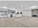 Open-concept kitchen with white cabinets, a center island, and modern appliances at 3020 Rockingham Cir, Orlando, FL 32808