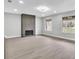 Spacious living room features a modern fireplace, recessed lighting, and large windows for natural light at 3020 Rockingham Cir, Orlando, FL 32808