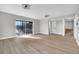 Open living room with sliding glass doors to an outdoor area and an easy access stairway at 3020 Rockingham Cir, Orlando, FL 32808