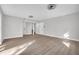 Bright living room with access to lower level and front entrance at 3020 Rockingham Cir, Orlando, FL 32808