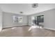 Large room with modern fan lighting and access to outdoor living spaces and serene views at 3020 Rockingham Cir, Orlando, FL 32808