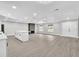 Open concept living room with hardwood floors, fireplace, and modern lighting at 3020 Rockingham Cir, Orlando, FL 32808