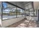 View of a screened patio with pool access, offering an indoor-outdoor living space with ample natural light at 3020 Rockingham Cir, Orlando, FL 32808