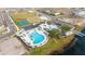 Aerial view of community amenities including pool, tennis courts, and playground at 3052 Ella Way, Saint Cloud, FL 34771