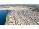 Aerial view of a lakefront community with many houses at 3052 Ella Way, Saint Cloud, FL 34771