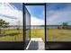 Open screened enclosure with a view of the lake at 3052 Ella Way, Saint Cloud, FL 34771