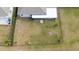 Overhead view of a fenced backyard with a patio and grass at 3052 Ella Way, Saint Cloud, FL 34771