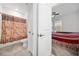 Bathroom with shower/tub combo, toilet, and linen closet at 3052 Ella Way, Saint Cloud, FL 34771