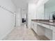 Bright bathroom boasts double vanity, and view of bedroom at 3052 Ella Way, Saint Cloud, FL 34771