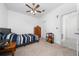 Bedroom with double bed, dresser, and ceiling fan at 3052 Ella Way, Saint Cloud, FL 34771