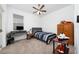 Bedroom with a double bed, dresser and desk at 3052 Ella Way, Saint Cloud, FL 34771